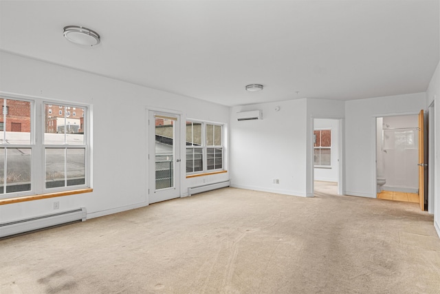193 St Paul St Unit 101, Burlington, VT 05401 - carpeted spare room with a wall mounted air conditioner, baseboard heating, and baseboards