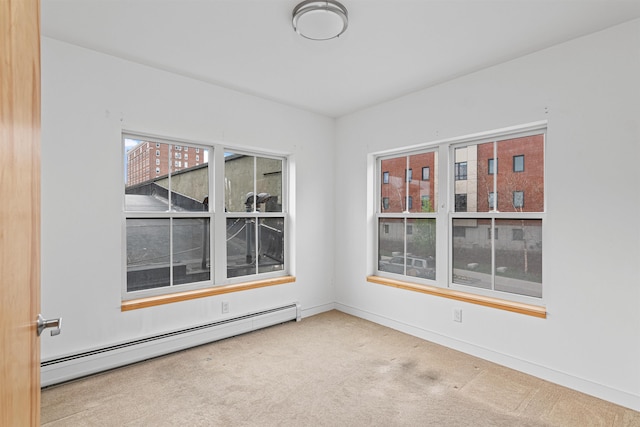 193 St Paul St Unit 101, Burlington, VT 05401 - spare room with a baseboard radiator, carpet floors, and baseboards
