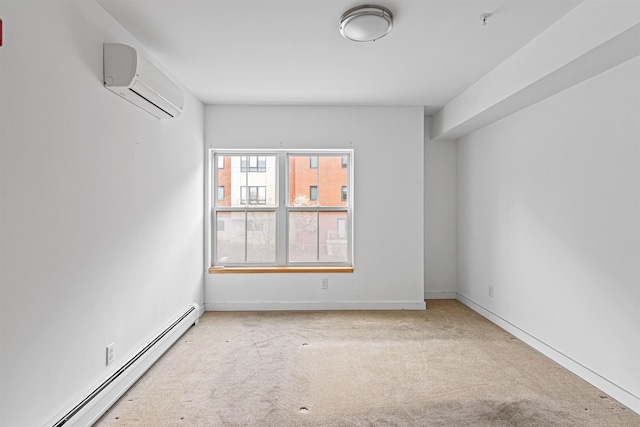 193 St Paul St Unit 101, Burlington, VT 05401 - carpeted spare room with baseboard heating, an AC wall unit, a pendent fire sprinkler, and baseboards