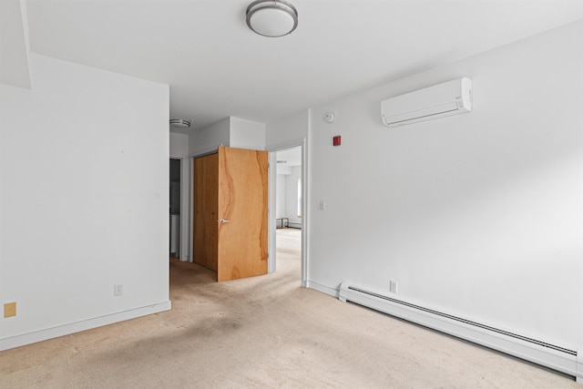193 St Paul St Unit 101, Burlington, VT 05401 - spare room with a baseboard heating unit, a wall unit AC, carpet, baseboards, and a smoke detector