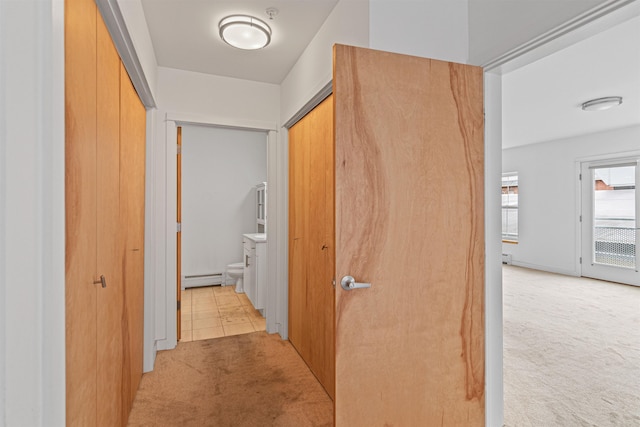 193 St Paul St Unit 101, Burlington, VT 05401 - hall featuring light carpet and baseboard heating
