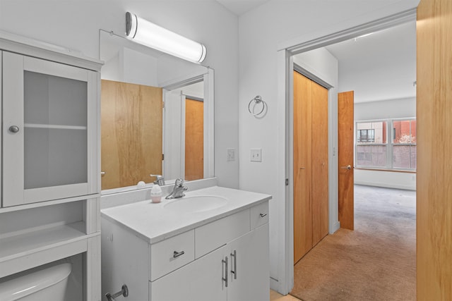 193 St Paul St Unit 101, Burlington, VT 05401 - half bathroom with vanity and toilet