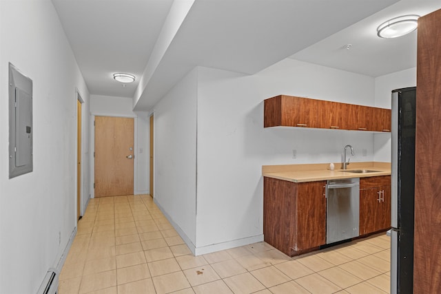 193 St Paul St Unit 101, Burlington, VT 05401 - kitchen with appliances with stainless steel finishes, a sink, light countertops, and light tile patterned floors
