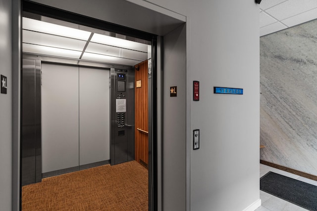 193 St Paul St Unit 101, Burlington, VT 05401 - hallway with elevator, a drop ceiling, and carpet flooring