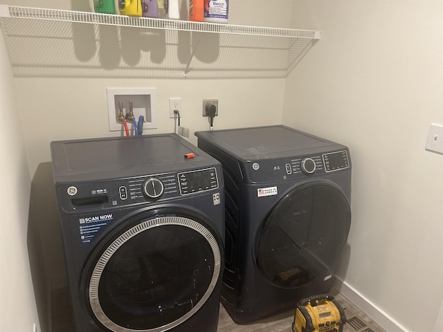 29 Igls Ln, Conway, NH 03818 - laundry room featuring washing machine and dryer and baseboards