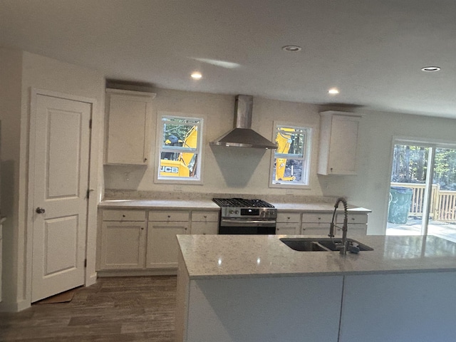 29 Igls Ln, Conway, NH 03818 - kitchen with wall chimney exhaust hood, a sink, gas stove, dark wood-style flooring, and white cabinets