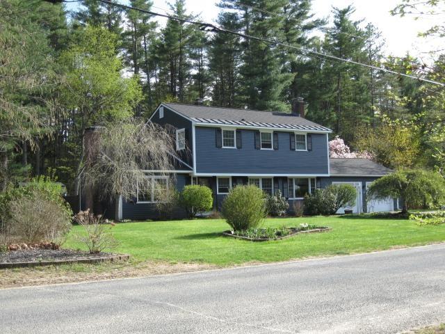 25 Centerview Dr, Swanzey, NH 03446 - colonial house featuring a chimney and a front lawn