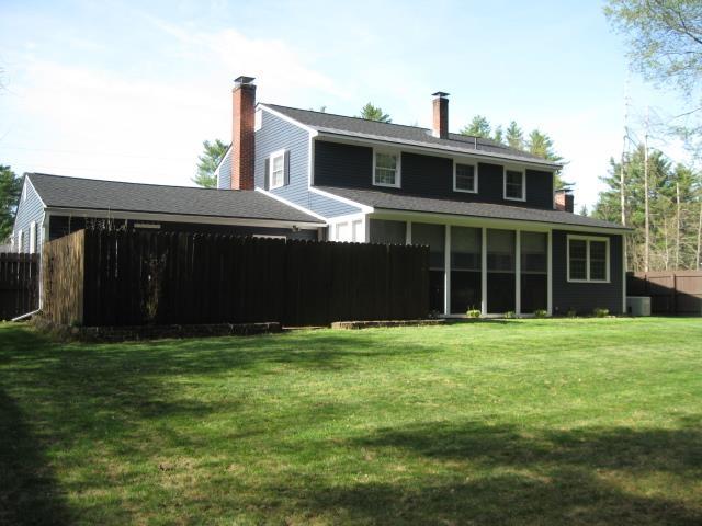25 Centerview Dr, Swanzey, NH 03446 - back of house featuring a chimney and a sunroom