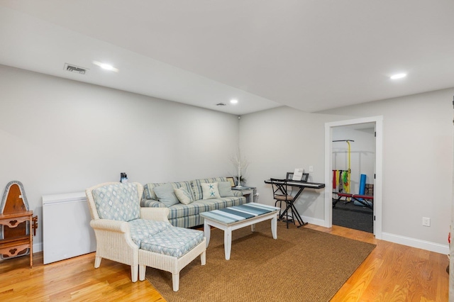 11 Carriage Hill Rd, Wilton, NH 03086 - living room with light wood-type flooring, recessed lighting, and baseboards