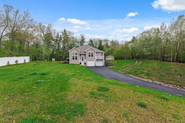 11 Carriage Hill Rd, Wilton, NH 03086 - view of front facade with an attached garage and driveway