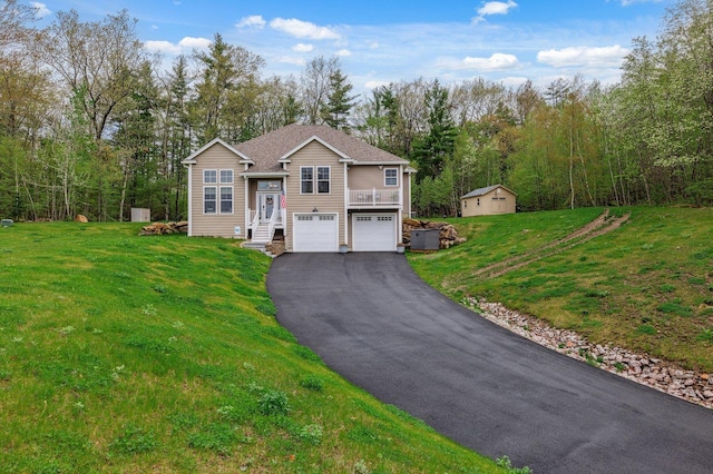 11 Carriage Hill Rd, Wilton, NH 03086 - view of front of home with driveway, a garage, and a front lawn