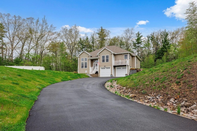 11 Carriage Hill Rd, Wilton, NH 03086 - view of front of property featuring asphalt driveway, an attached garage, and a front lawn