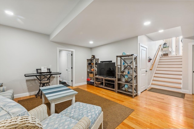 11 Carriage Hill Rd, Wilton, NH 03086 - living room with wood finished floors, recessed lighting, baseboards, and stairway