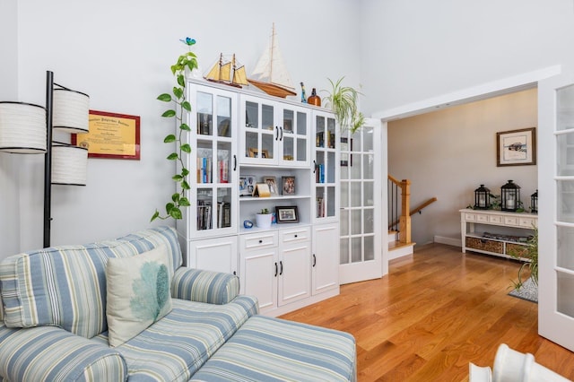 11 Carriage Hill Rd, Wilton, NH 03086 - living area with light wood-type flooring and stairs