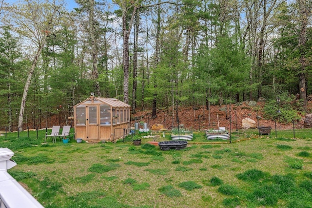 11 Carriage Hill Rd, Wilton, NH 03086 - view of green lawn featuring an exterior structure and an outdoor structure