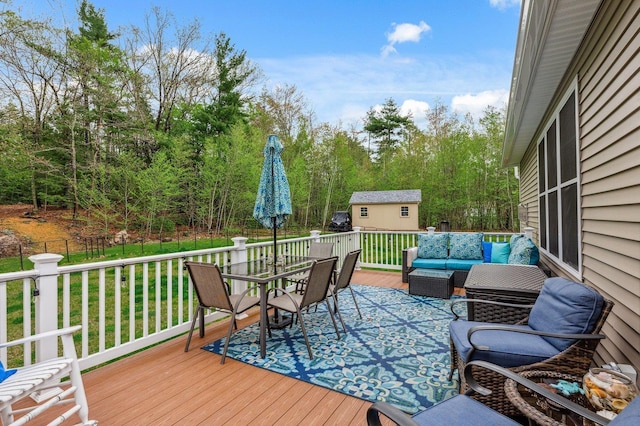 11 Carriage Hill Rd, Wilton, NH 03086 - wooden deck featuring outdoor dining area, an outdoor hangout area, and view of scattered trees