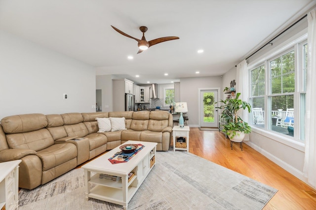 11 Carriage Hill Rd, Wilton, NH 03086 - living room featuring light wood-type flooring, recessed lighting, a ceiling fan, healthy amount of natural light, and baseboards