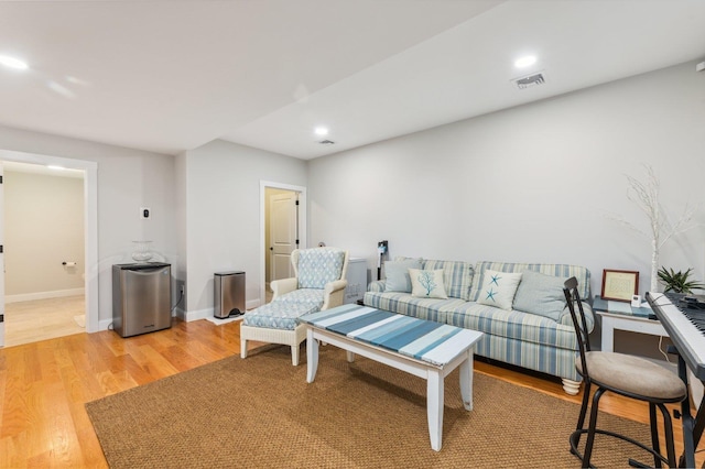 11 Carriage Hill Rd, Wilton, NH 03086 - living room featuring light wood-style flooring, baseboards, recessed lighting, and a desk