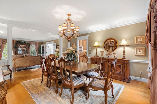 12 Mcintosh Ln, Bedford, NH 03110 - dining space with a chandelier, light wood finished floors, and ornamental molding