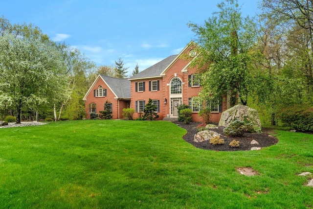 12 Mcintosh Ln, Bedford, NH 03110 - colonial home with brick siding and a front lawn