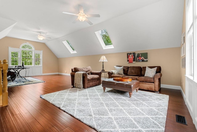 12 Mcintosh Ln, Bedford, NH 03110 - living area with a skylight, a ceiling fan, dark wood-style floors, lofted ceiling, and baseboards