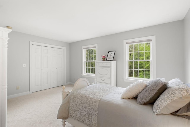 12 Mcintosh Ln, Bedford, NH 03110 - bedroom featuring carpet flooring, baseboards, and a closet
