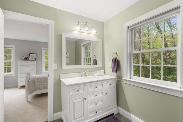 12 Mcintosh Ln, Bedford, NH 03110 - ensuite bathroom with baseboards and vanity