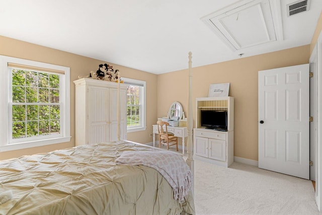 12 Mcintosh Ln, Bedford, NH 03110 - bedroom featuring attic access, light carpet, multiple windows, and baseboards