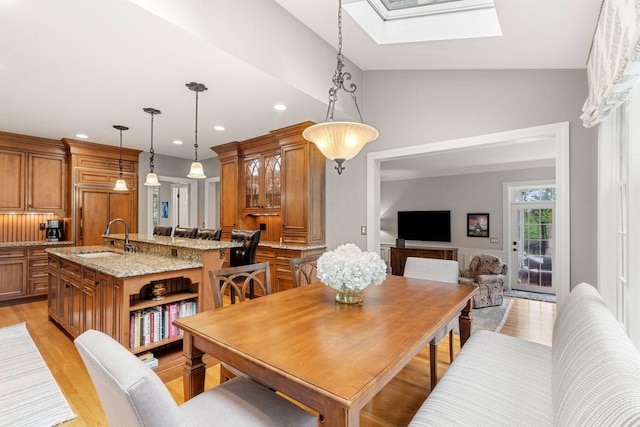 12 Mcintosh Ln, Bedford, NH 03110 - dining space featuring a skylight, light wood-style flooring, recessed lighting, and vaulted ceiling