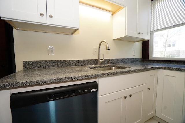 489 Hanover St, Manchester, NH 03104 - kitchen featuring stainless steel dishwasher, a sink, white cabinets, and dark countertops