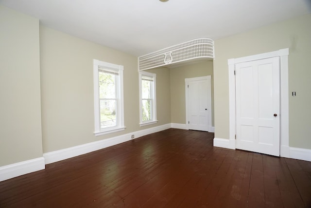 489 Hanover St, Manchester, NH 03104 - unfurnished room with dark wood-style flooring and baseboards