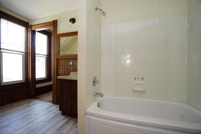 489 Hanover St, Manchester, NH 03104 - bathroom with wood finished floors, bathing tub / shower combination, and vanity