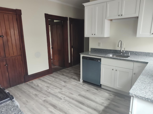 489 Hanover St, Manchester, NH 03104 - kitchen with dishwashing machine, a sink, white cabinetry, light wood-style floors, and light stone countertops