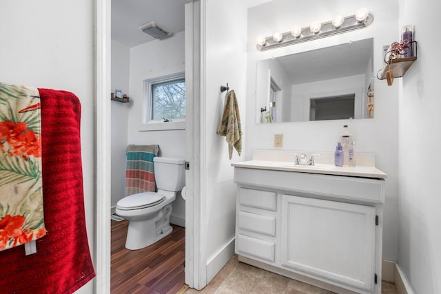 28 Putnam Hill Rd, Lyndeborough, NH 03082 - half bathroom with toilet, vanity, baseboards, and wood finished floors