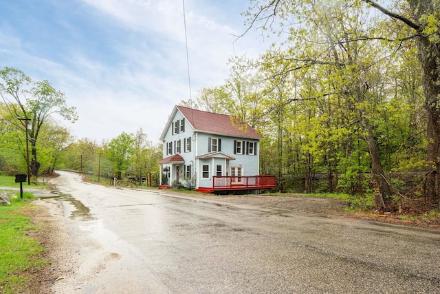 28 Putnam Hill Rd, Lyndeborough, NH 03082 - view of front of house featuring a wooden deck and a shingled roof