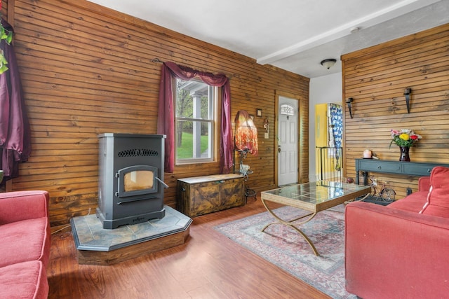 28 Putnam Hill Rd, Lyndeborough, NH 03082 - living area with wooden walls, a wood stove, and wood finished floors