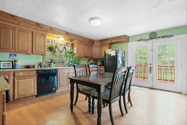 28 Putnam Hill Rd, Lyndeborough, NH 03082 - kitchen with black appliances, a textured ceiling, healthy amount of natural light, and brown cabinetry