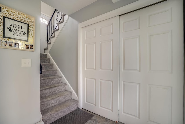 stairway featuring baseboards