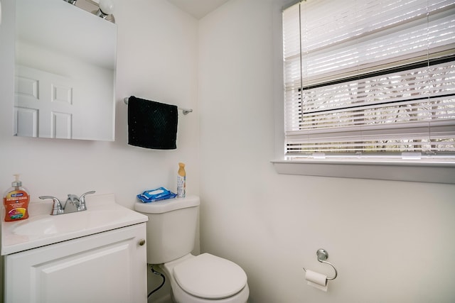 half bath with toilet and vanity
