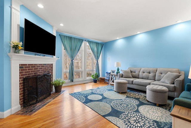 38 Farmington Rd, Nashua, NH 03060 - living room with a fireplace, wood finished floors, recessed lighting, and baseboards