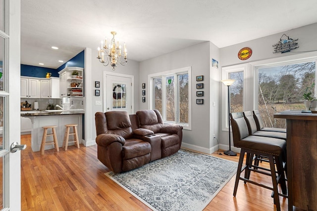 38 Farmington Rd, Nashua, NH 03060 - living area featuring a chandelier, light wood-type flooring, baseboards, and recessed lighting