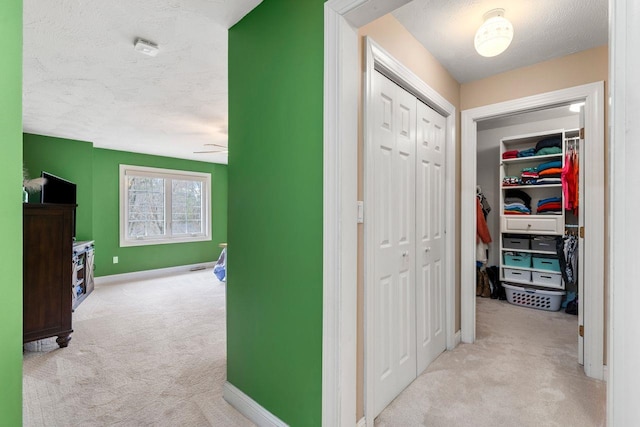 38 Farmington Rd, Nashua, NH 03060 - corridor with carpet flooring, a textured ceiling, and baseboards