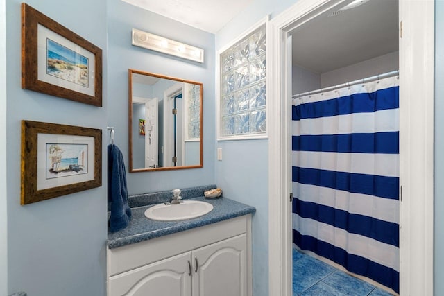 38 Farmington Rd, Nashua, NH 03060 - bathroom featuring vanity, curtained shower, and tile patterned flooring