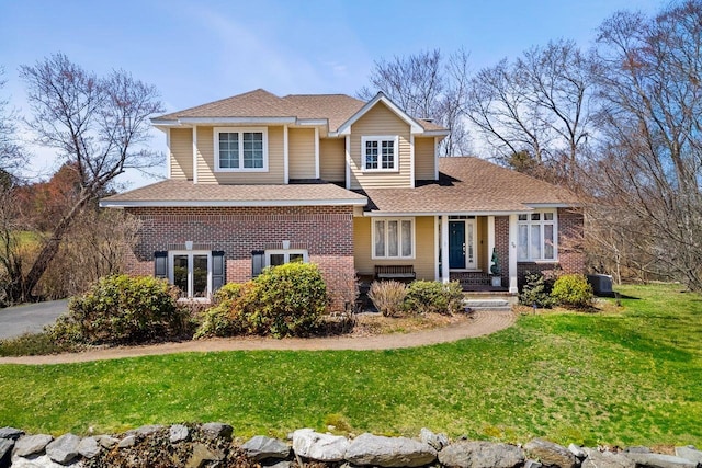 38 Farmington Rd, Nashua, NH 03060 - view of front of house with brick siding, a front yard, a shingled roof, and covered porch