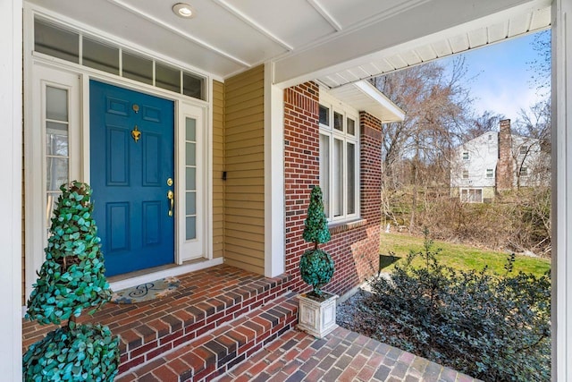 38 Farmington Rd, Nashua, NH 03060 - entrance to property with brick siding and covered porch