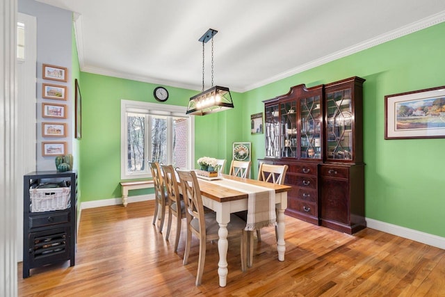 38 Farmington Rd, Nashua, NH 03060 - dining space featuring baseboards, light wood-style flooring, and crown molding