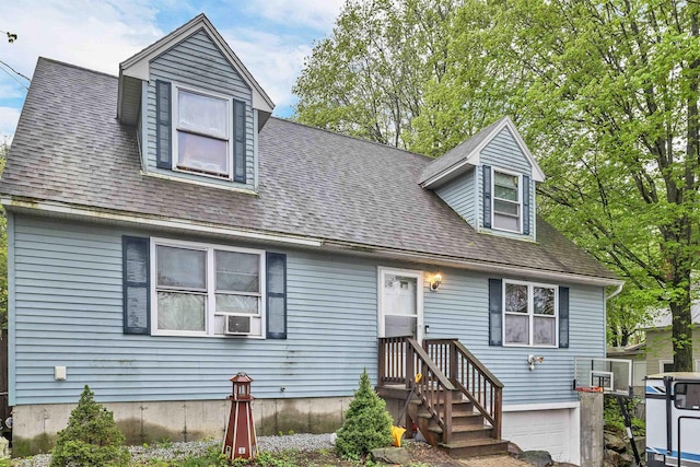 new england style home with roof with shingles