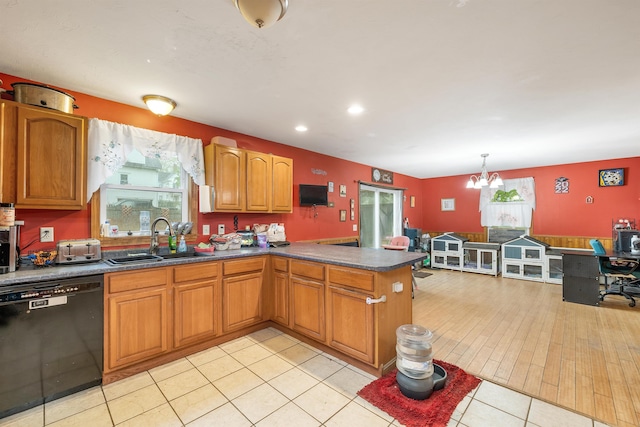 kitchen featuring dishwasher, a sink, plenty of natural light, a peninsula, and recessed lighting
