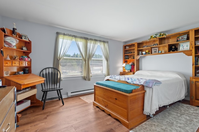 15 Garys Dr, Littleton, NH 03561 - bedroom featuring a baseboard radiator and light wood-style floors