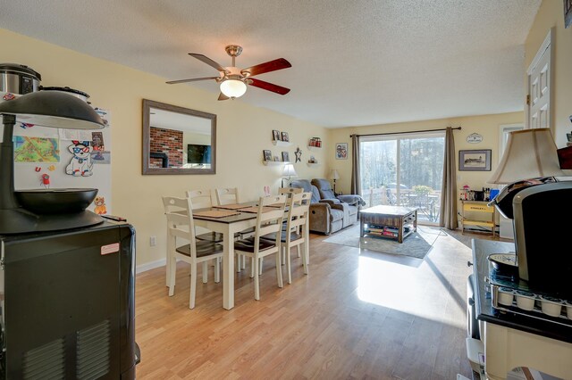 45 Haynesville Ave Unit 3, Conway, NH 03818 - dining room with ceiling fan, light wood-style floors, and a textured ceiling